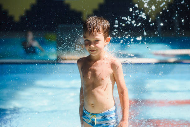 istock boy is in the water park. 1452739294