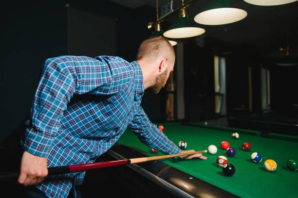 istock Playing billiard - Close-up shot of a man playing billiard 1452739920