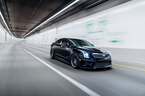 Seattle, WA, USA
12/25/2022
Black Cadillac ATS-V driving through a tunnel