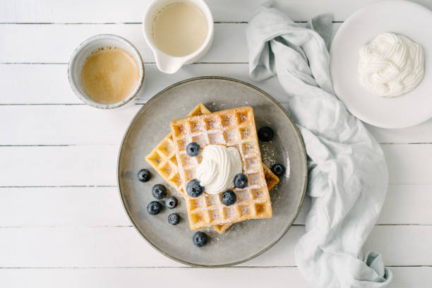 istock Waffles with blueberries and a cup of coffee 1452740615