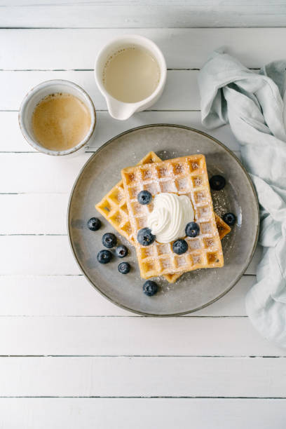 istock Waffles with blueberries and a cup of coffee 1452740628