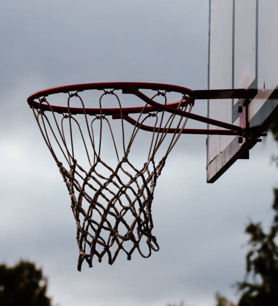 istock Low angle view of basketball hoop against sky 1452740630