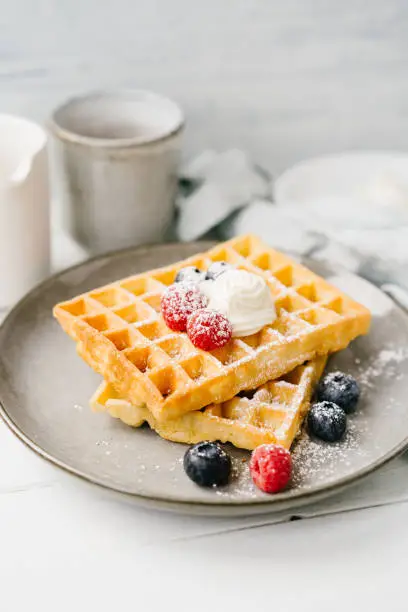 Waffles, berries and curd cheese