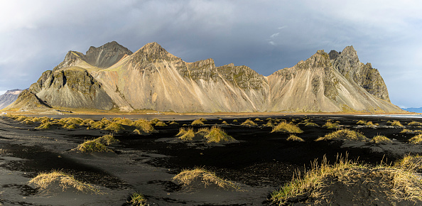Vestrahorn is a mountain in south-east Iceland. Vestrahorn is a mountain on the Stokksnes peninsula in Iceland. Vestrahorn has dramatic peaks reaching up to 454 meters (1490 ft). It rises out of a flat, black sand beach and dominates the view.