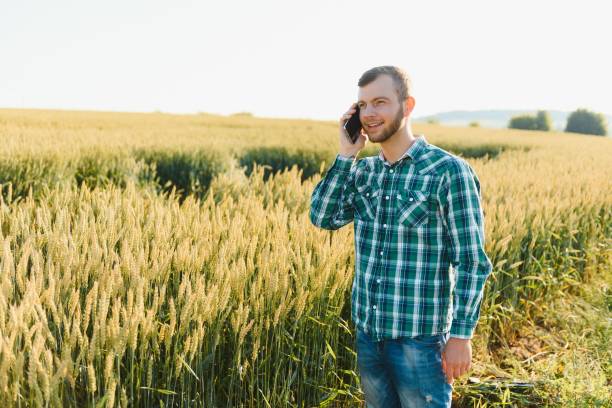 istock Young farmer in a wheat field before the harvest. 1452742771