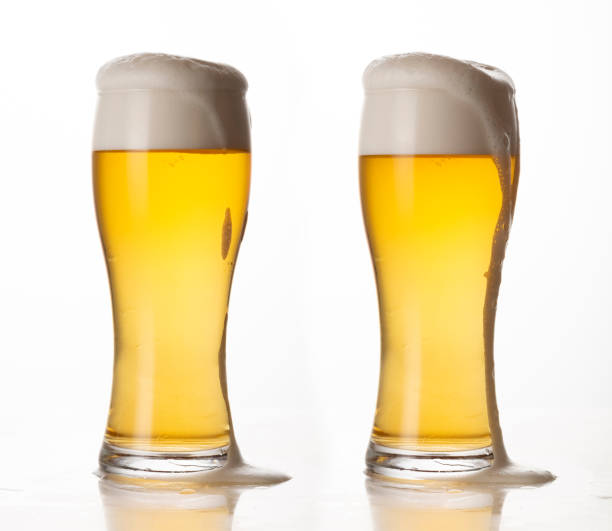 istock Glass of light beer isolated on white background; foam; bubbles; close-up 1452743502