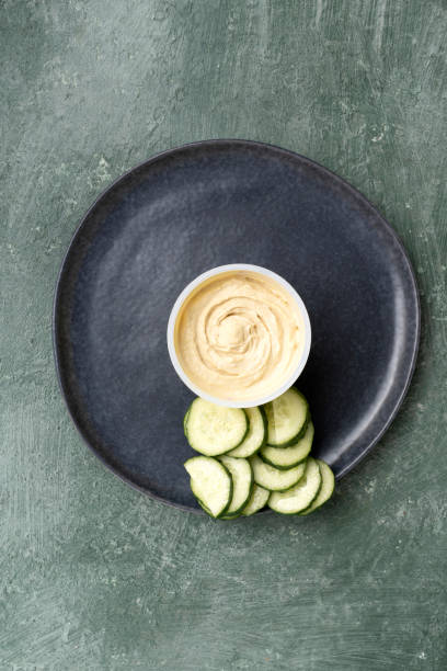Healthy snack chickpea hummus and cucumbers