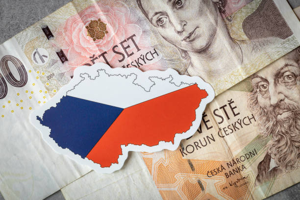 czech flag against the background of money, the concept of strengthening the czech crown, the strongest currency in eastern europe - czech culture currency wealth coin imagens e fotografias de stock