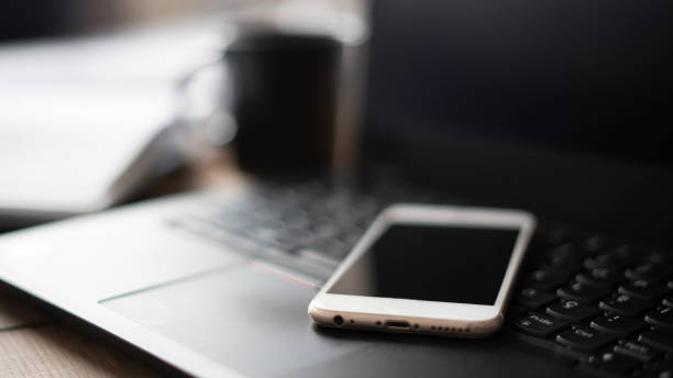 istock The phone is on the laptop. 1452750094