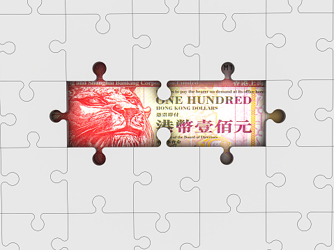 Hong Kong Dollars with jigsaw puzzle