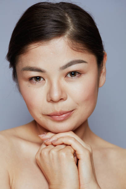 istock young asian female on blue 1452750411