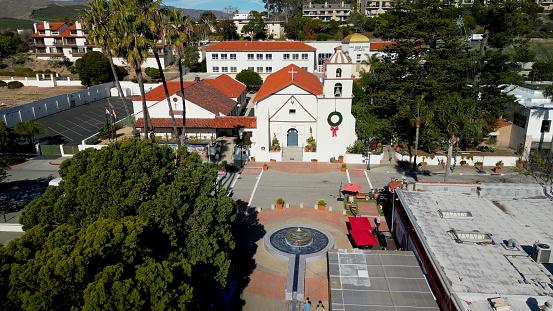 Day time aerial view of Mission Basilica San Buenaventura - a Spanish mission founded in 1782. The Mission serves the community of Ventura as a parish church today.
