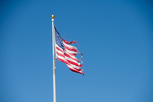 Low angle view of American flag on pole