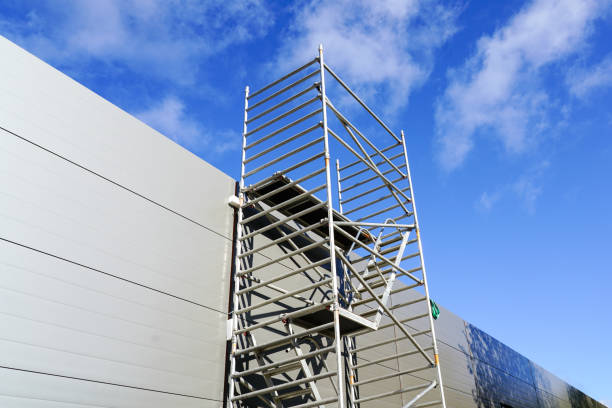 istock Modern metal tubular multilevel scaffolding next to the sandwich panel facade 1452754015