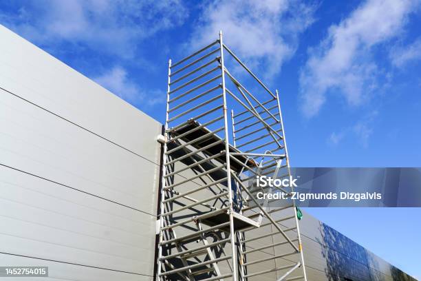 Modern Metal Tubular Multilevel Scaffolding Next To The Sandwich Panel Facade Stock Photo - Download Image Now