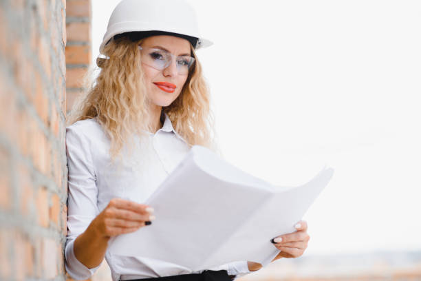 istock Women Engineer look at Building Glass. 1452754131