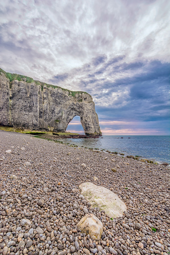 Scenic view of Etretat cliffs against dramatic stormy sky in Normandy, France