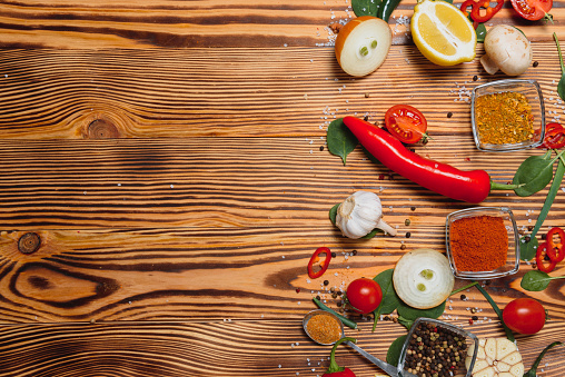 Cooking table. Background with spices and vegetables. Top view. Free space for your text.