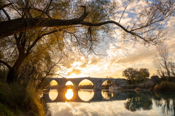 historical ottoman bridge over the river. autumn landscape ,sunset