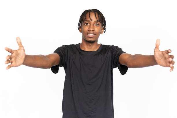 istock Joyful young man standing with outstretched hands for hugs 1452760726