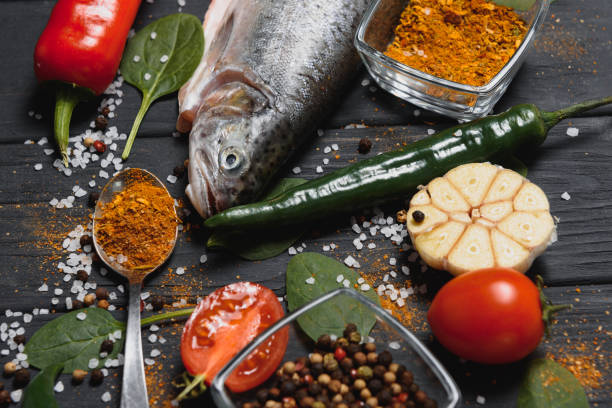 fresh trout with spices and seasonings top view, flat lay