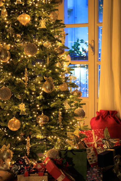 istock House Christmas tree and presents 1452764095