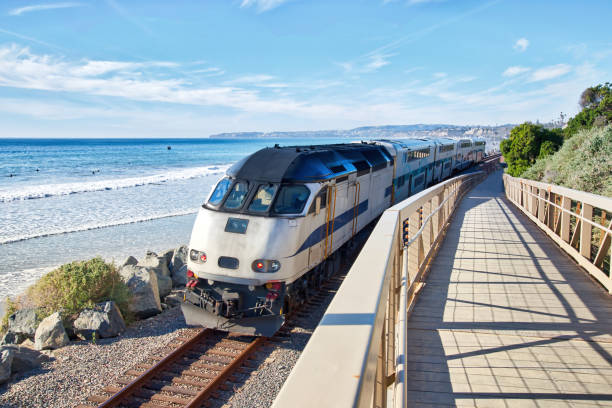 Metrolink Commuter Train running along San Clemente Beach stock photo