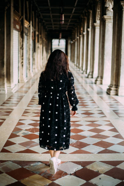 istock Woman with dotted dress exploring venice 1452769794