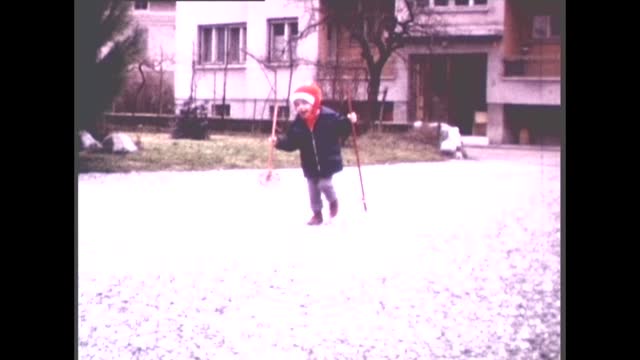 70's 8mm Footage - 2 Years Old Boy Learning how to Use Ski Poles Outdoors in 1970s