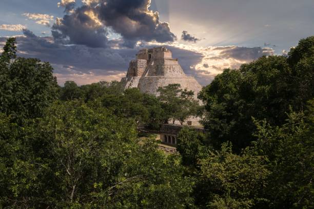 Picturesque view of the famous Pyramid of the Magician in Uxmal city, Yucatan A picturesque view of the famous Pyramid of the Magician in Uxmal city, Yucatan uxmal stock pictures, royalty-free photos & images