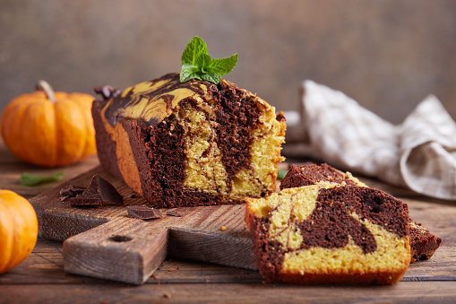 Pound marble cake with chocolate and pumpkin layers. Delicious homemade dessert.