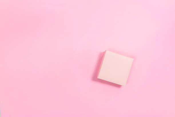 istock Pink gift box on a pink background. Template for design or text. 1452770887