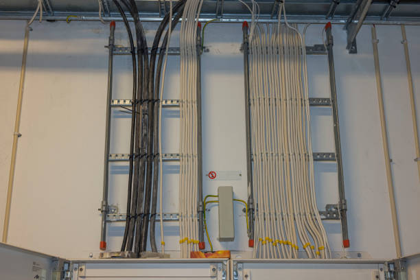 Close-up interior view of organized cable store mounted on wall. Sweden.