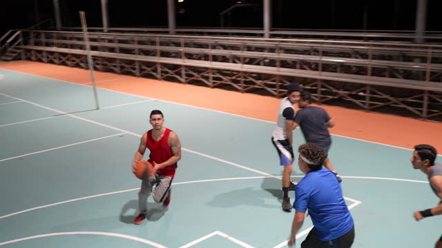 Basketball team having a match at a sports court