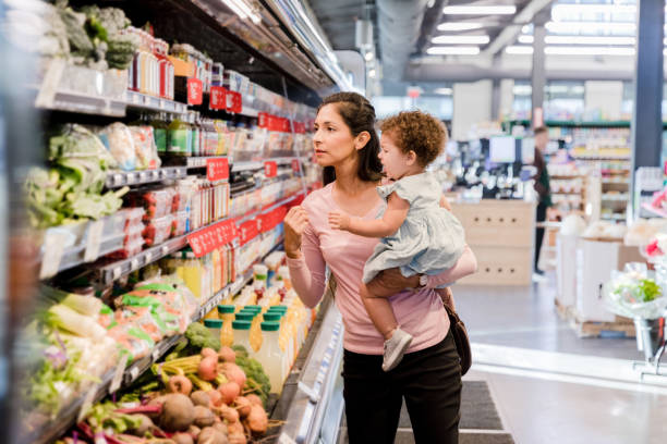 istock Young mother grocery shopping 1452774214