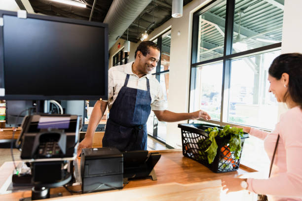 istock Male grocery store employee working 1452774243