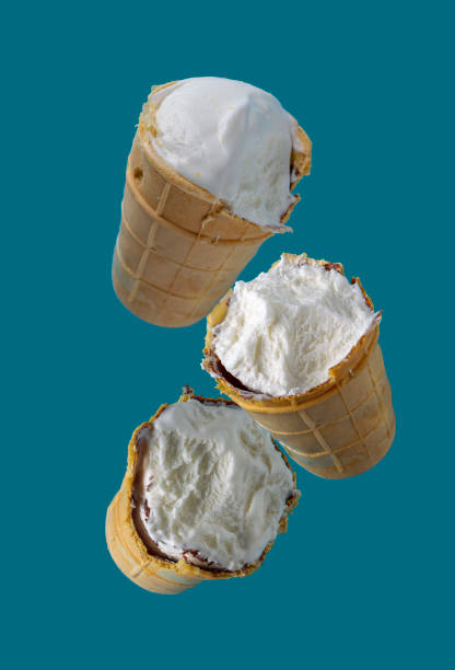istock bitten ice cream in waffle cups flies on a blue background 1452775196