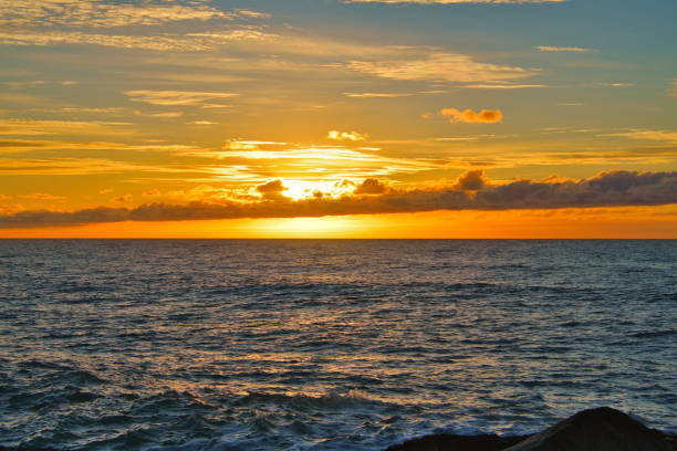 A beautiful sunset on the beach and sea with waves, Denmark