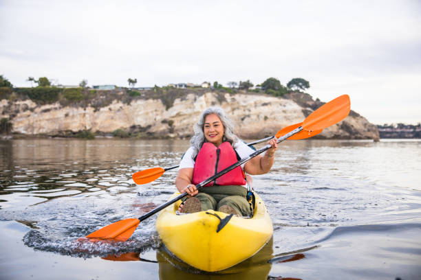 A beautiful senior Hispanic couple kayaking