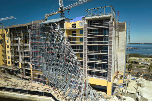 Aerial view of ruined by hurricane Ian construction scaffolding on high apartment building site in Port Charlotte, USA Aerial view of ruined by hurricane Ian construction scaffolding on high apartment building site in Port Charlotte, USA. collapsing stock pictures, royalty-free photos & images
