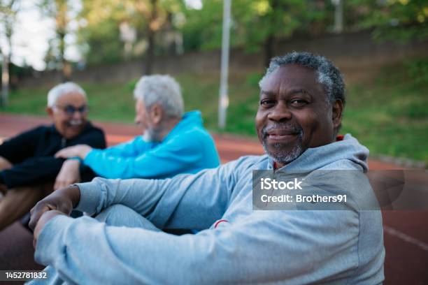 Senior Man Taking Rest After Workout At Outdoors Exercise Court Stock Photo - Download Image Now