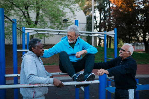 istock Three senior men chatting at outdoor gym 1452781852