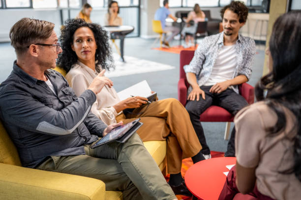 istock Man giving feedback on business start up plan 1452788513