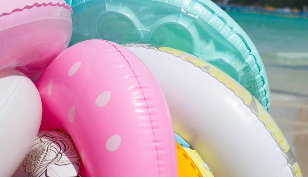istock Inflatable rings on the beach. Summer concept 1452794921