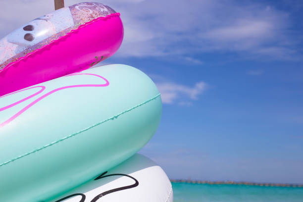 istock Inflatable rings on the beach. Summer concept 1452794927