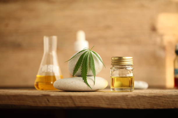 cbd oil bottle and leaf cannabis. marijuana stock photo