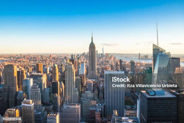 Manhattan Downtown And Skyscrapers At Sunset Stock Photo - Download Image Now - New York City, New York State, Urban Skyline