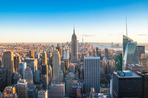 manhattan downtown and skyscrapers at sunset. - manhattan imagens e fotografias de stock