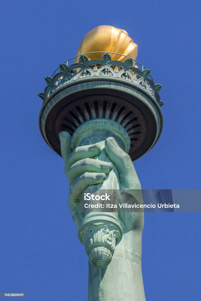 Detail of The Statue of Liberty (La Liberté éclairant le monde), Liberty Island, New York City, United States. Flaming Torch Stock Photo