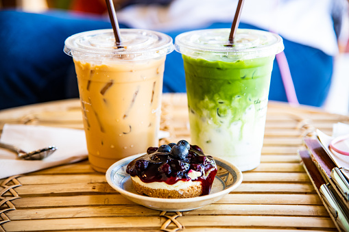Iced Matcha Latte and Iced Coffee with Blueberry Cheesecake, Thailand.